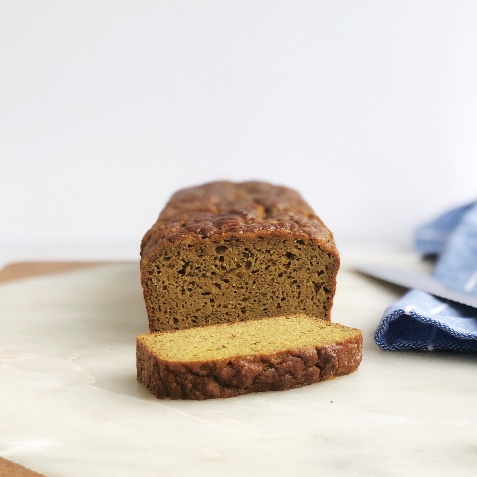 Recipe for Golden Grain-free Banana Bread made with JOYÀ Glow turmeric elixir blend on the blog at joya.ca.