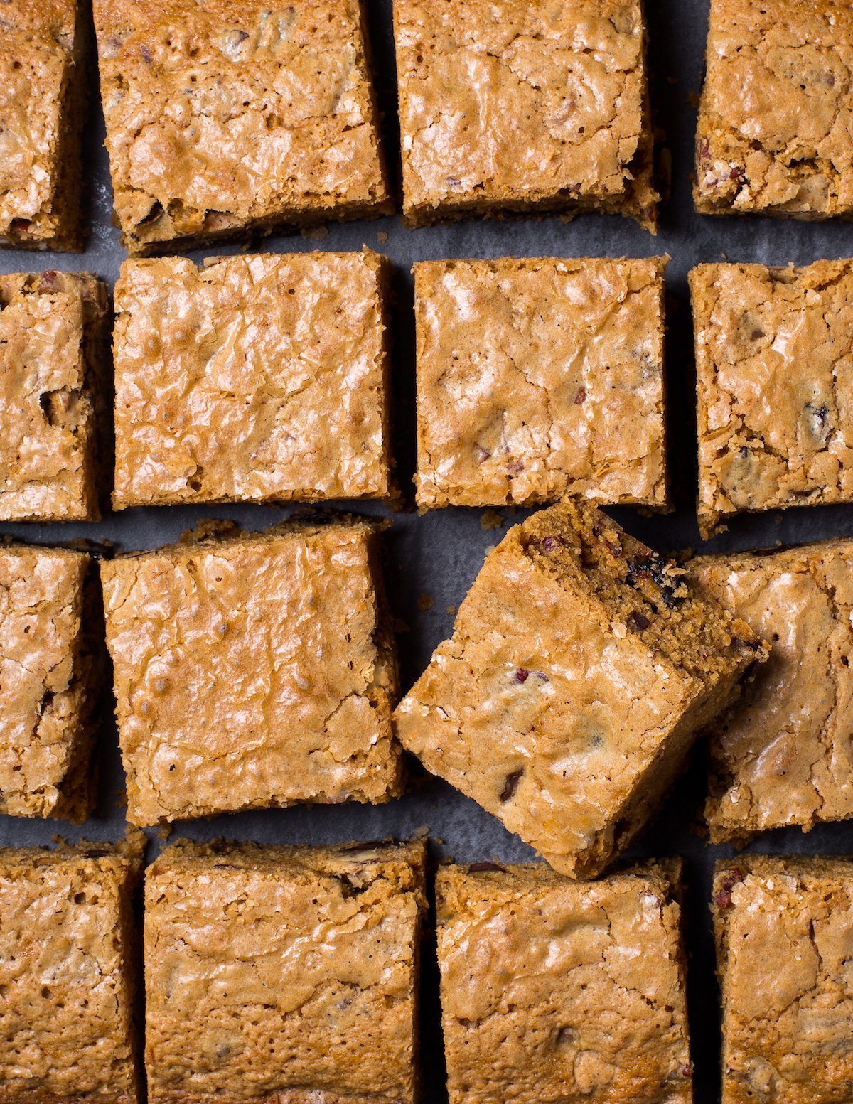 Aerial close-up shot of cut gluten-free blondie squares with chocolate chips.