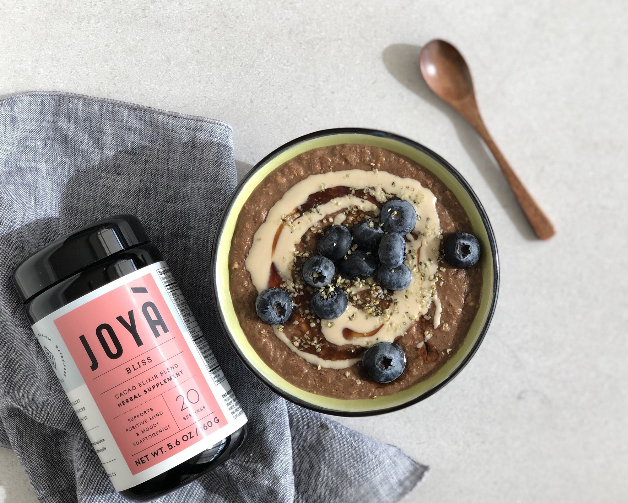 Grain-free cocoa-tahini hot cereal recipe with JOYÀ Bliss cacao elixir blend