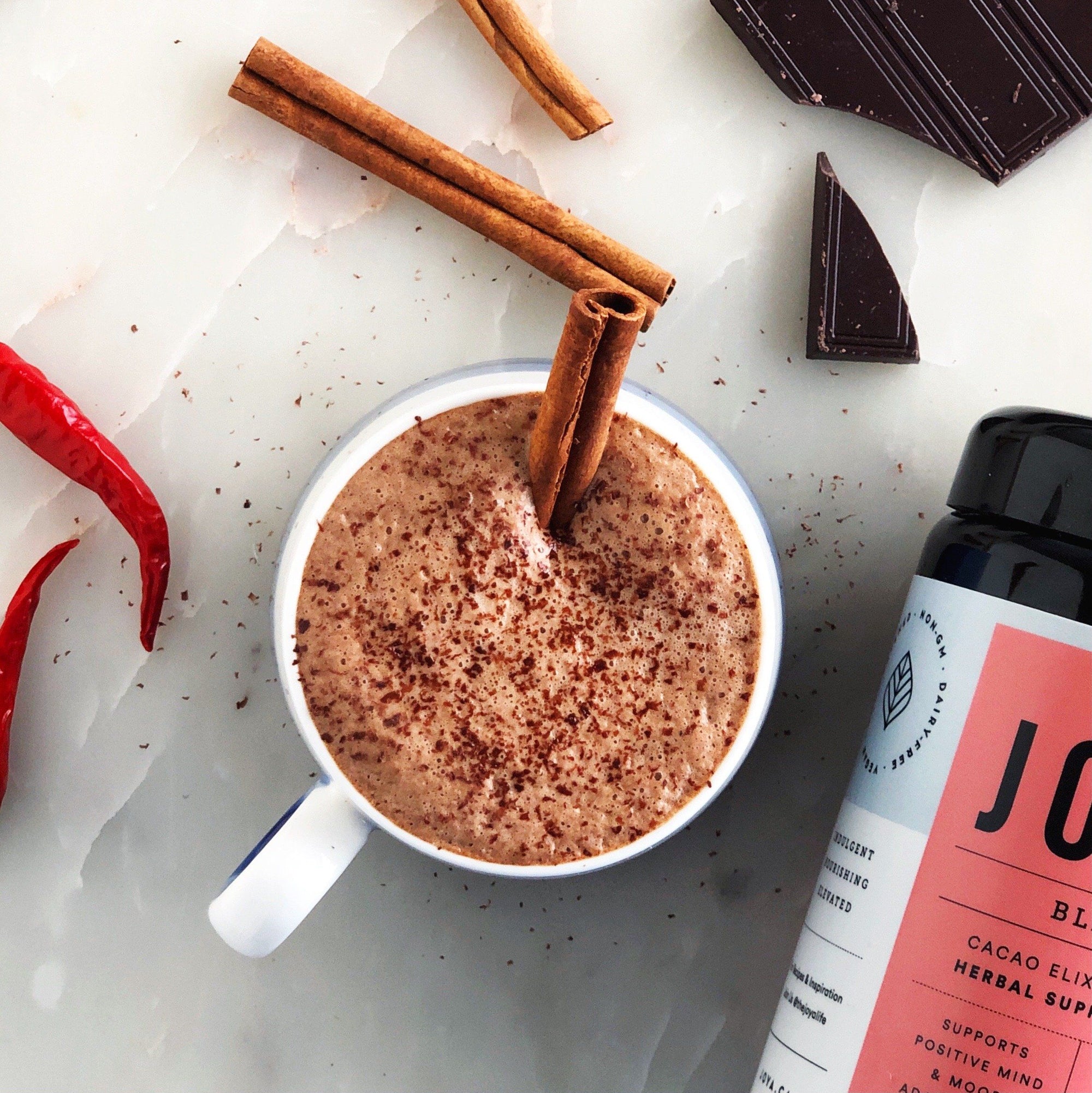 Image of a cup of Mexican Hot Chocolate with JOYA Bliss Elixir