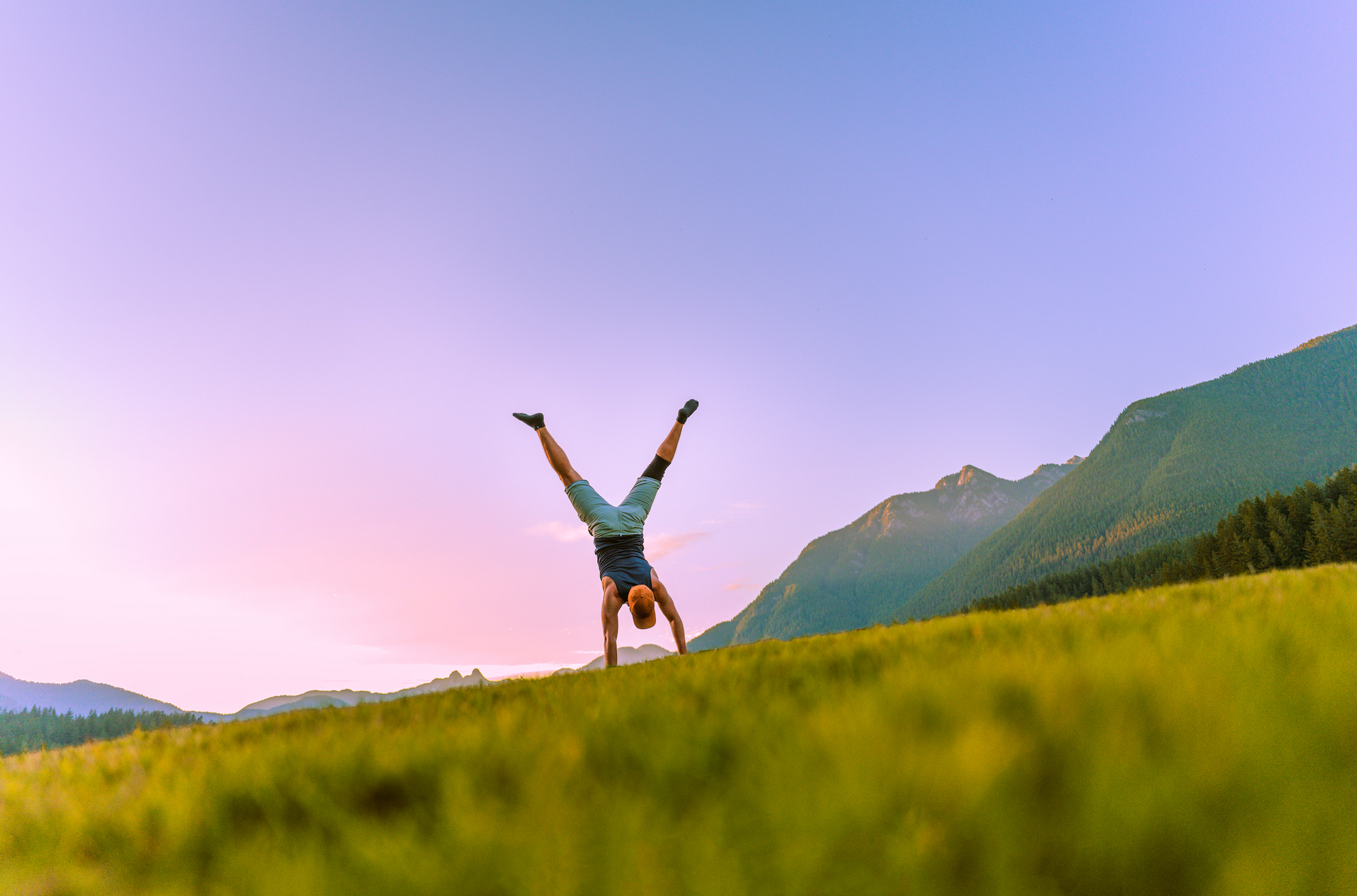 Person doing a cartwheel in a field