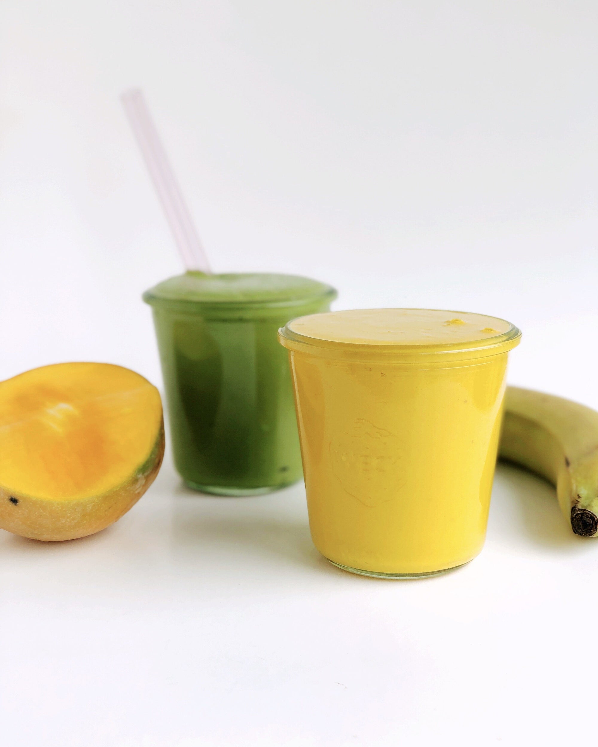 Image of two JOYÀ smoothies featuring the Matcha-Moringa and Turmeric Elixir Blends