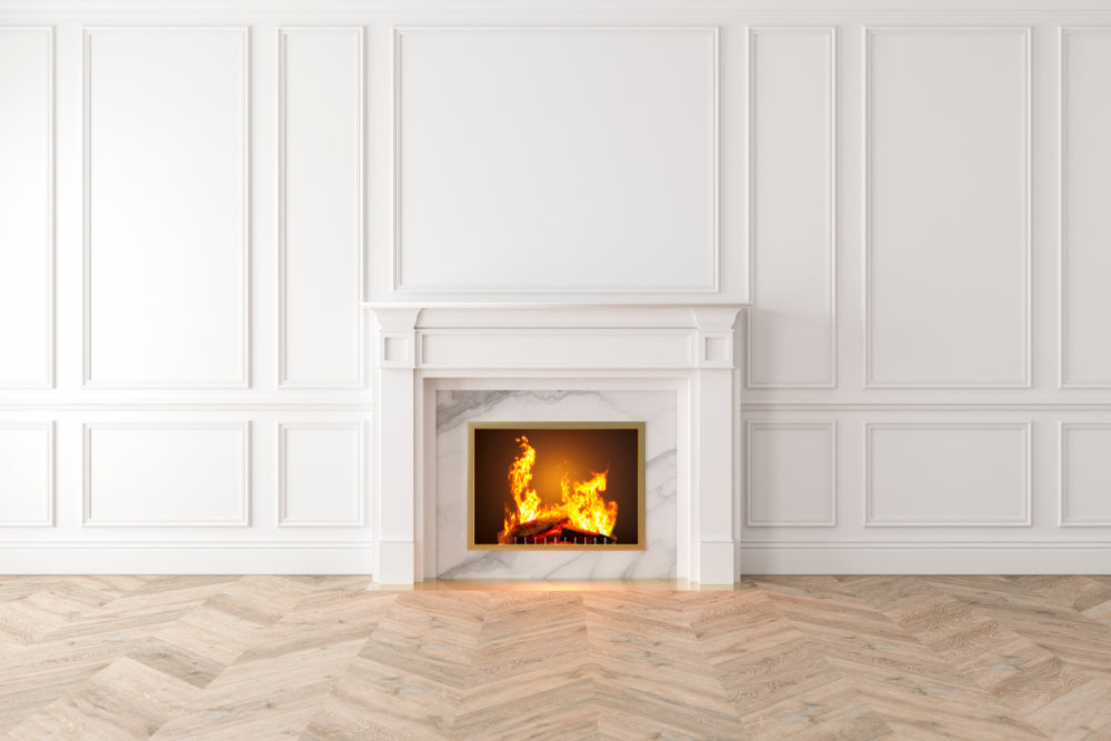 Burning fireplace on blank white wall