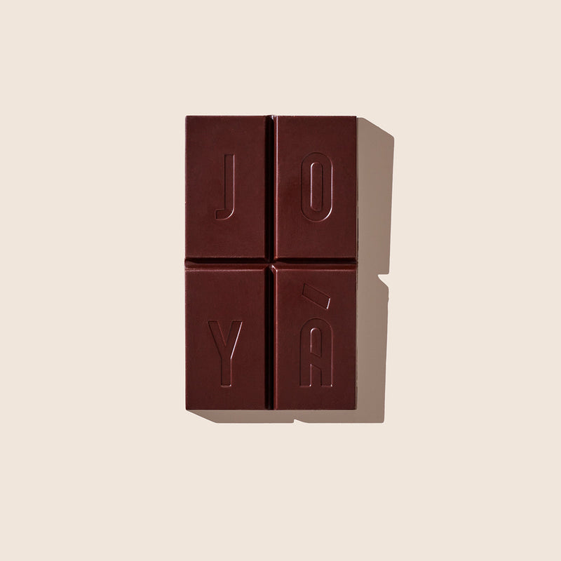 Unwrapped bar of JOYÀ Glow Functional Chocolate
